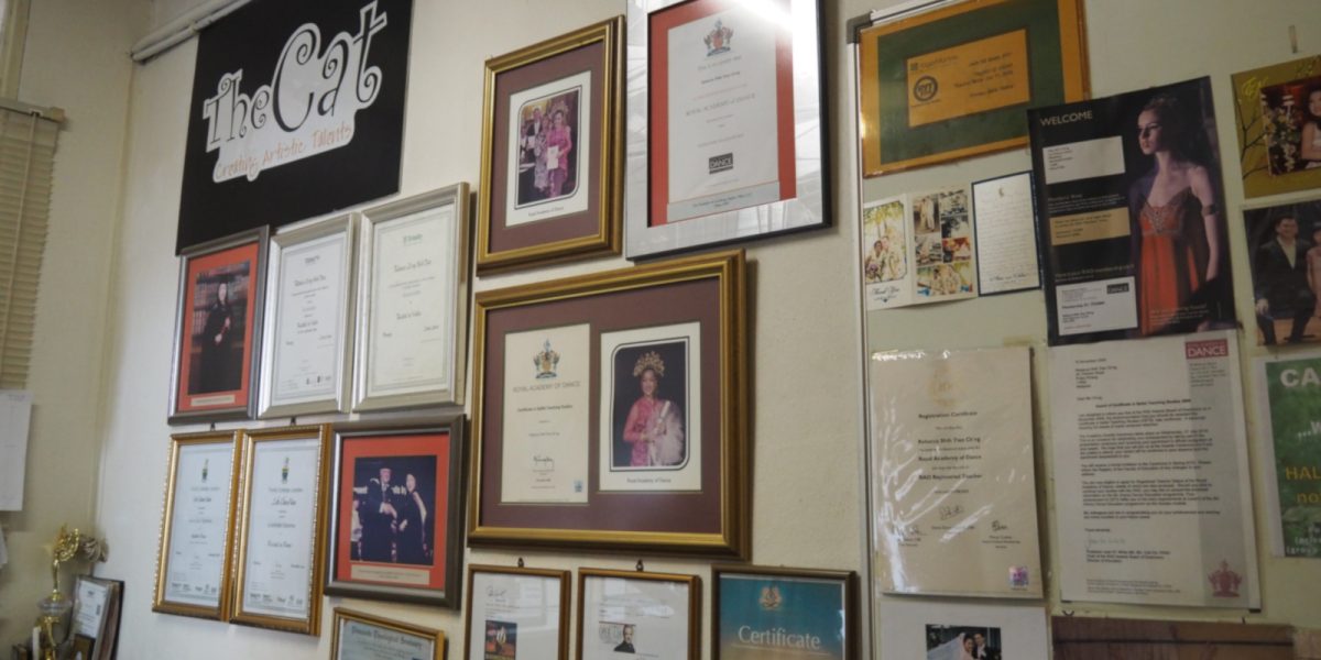 Music school wall displaying teachers' certificates